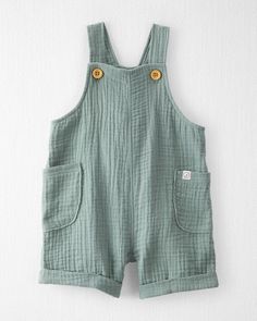 Spring Moss Green Baby Organic Cotton Gauze Shortall | carters.com Summer Shortalls With Side Pockets And Relaxed Fit, Cotton Bib Front Overalls In Solid Color, Solid Cotton Bib Front Overalls, Cotton Overalls With Bib Front, Solid Cotton Overalls With Bib Front, Summer Cotton Overalls In Solid Color, Spring Cotton Shortalls With Relaxed Fit, Cotton Shortalls With Side Pockets And Relaxed Fit, Spring Casual Solid Bubble Romper