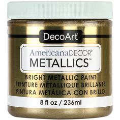 a jar of metallic paint sitting on top of a white table