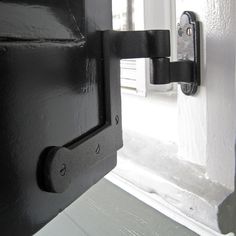 an open door with a black handle on it