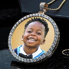 Personalized with your photo makes this pendant sentimental and everlasting. A perfect gift to keep the loved ones close to the heart. Send us your photo on our whats app (201-753-3964) and we will do the rest. Set with 64 Cubic Zirconia that can be upgraded to diamonds. Available in silver of gold tone. Comes with 24" bali style chain. Size: 1"x1" Stones1.9mm SKU: 229SUP2W Customized Round Pendant Keepsake Jewelry, Customized Pendant Jewelry For Keepsake, Customizable Pendant Jewelry For Keepsake, Keepsake Diamond Pendant Jewelry, Diamond Pendant Necklace For Keepsake, Diamond Pendant Jewelry For Keepsake, Round Locket Jewelry For Personalized Gift, Personalized Round Locket Jewelry, Personalized Round Locket Jewelry Gift