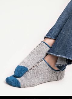 a woman's feet in blue and white socks