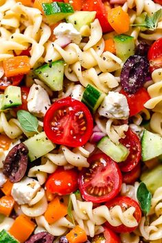 pasta salad with tomatoes, cucumbers, olives and feta cheese