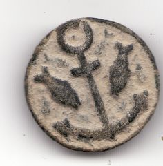 an ancient coin with two birds on it