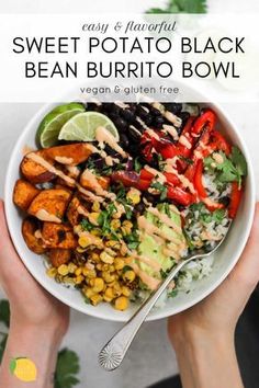 a person holding a bowl filled with sweet potato black bean, corn and avocado salad