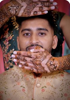 a man with henna on his head and hands