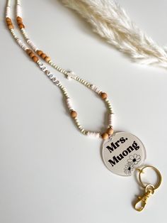 This adorable teacher lanyard is super cute and customizable. Enjoy this boho style to show off some personality. Such a cute accessory. In the personalization box please choose the color of beads you want -- (only one color). Please leave the name you want on the acrylic round with the correct spelling. If you want to change "Be Kind" leave that word(s) in the box as well.  These make the cutest graduation gift, teacher gift or birthday gift Handmade White Lanyards For Gift, Handmade White Lanyard For Gift, Handmade White Lanyards As Gifts, Handmade White Lanyard Gift, Customizable White Lanyards For Gifts, Customizable White Lanyards As Gifts, Customizable Adjustable White Lanyards, Customizable White Lanyards, Adjustable White Lanyards For Crafting