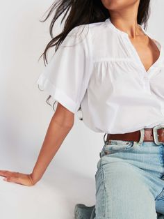 Your spring capsule called. It needs this. With a casual notch neckline, a slightly gathered seam across the bust, and boxy short sleeves, it's the blouse that's perfect for low-key coffee dates and subtle chic looks. (This one comes in White.) | Women's Filippa Blouse Top in White | Ethical Essentials Chic Short Sleeve Top For Casual Gatherings, Effortless Short Sleeve Blouse For Casual Gatherings, Chic Short Sleeve Blouse For Casual Gatherings, Classic Short Sleeve Top For Everyday Spring, White Blouse For Casual Gatherings, Casual Flutter Sleeve Blouse For Daywear, Short Sleeve Blouse For Casual Spring Gatherings, Casual Blouse With Flutter Sleeves For Daywear, Feminine Short Sleeve Blouse With Relaxed Fit