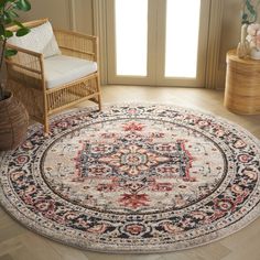 a round rug with an ornate design on the center in a room next to a chair