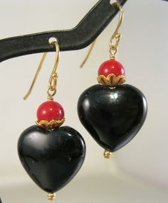 Wonderful vintage genuine black onyx and red coral gold filled drop or dangle pierced earrings.  They measure 1 1/2" long including the earring wires.  Unmarked but tested gold filled.  Total weight of the pair is 5.8 grams.  In excellent gently used vintage condition.  Please note, items in photos may appear larger than actual size. Be sure to read description for size and check all photos for comparison. 24207 ------------------------------------- Your item will arrive in a complimentary organza gift bag; OR, you can upgrade to our premium gift wrap design for only $3.00 extra which includes a beautiful gift box, candy, decoration, ribbon & gift card. Please be sure to check out my other shop where you can find custom personalized pocket watches and other gifts for everyone on your shopp Black Earrings For Valentine's Day Anniversary, Black Earrings For Anniversary On Valentine's Day, Elegant Black Heart Earrings For Anniversary, Black Heart Earrings For Pierced Ears As Gift, Black Heart Earrings As A Gift, Black Heart Beads Dangle Jewelry, Black Heart-shaped Earrings For Gift, Black Heart-shaped Pierced-style Jewelry, Black Dangle Heart Pierced Earrings