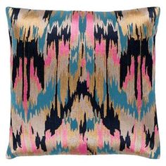 a blue, pink and gold pillow with an abstract design