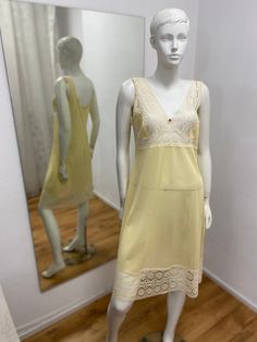 Yellow vintage slip dress, M size.   1980s 100% polyamide Size: 38/M Length: 107 cm / 42.1 inches Bust:  92 cm / 36.2 inches Waist: 84 cm / 33.07  inches Hips: 94 cm / 37 inches  * Please note that actual colors may vary due to your computer resolution and monitor color restrictions *Clothes  from smoke free house *Please contact me if you have any questions Thank you visiting my shop Instagram  - IvziteVintageFashion Ilze Vintage V-neck Slip Dress For Spring, Vintage Silk Dress With Spaghetti Straps, Vintage Sleeveless Silk Slip Dress, Sheer Vintage Slip Dress, Vintage Silk Slip Dress With Spaghetti Straps, Sheer Sleeveless Slip Dress For Daywear, Sheer Camisole Slip Dress For Daywear, Vintage Sheer Slip Dress, Vintage Camisole Slip Dress For Daywear