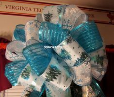 a blue and white christmas tree bow