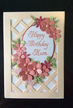 a birthday card with flowers on it and the words happy birthday mum written in pink