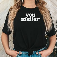 YOU MATTER Shirt with "You Matter" written on the front and back Unisex 100% cotton making shirt super soft, comfortable and lightweight. Runs true to size Machine wash inside out in cold water Questions?  Contact me, I want to hear from you. Concerns? Kindly reach out to me so I can make things right!  Thank You for choosing MADesigns! Inspirational Black Pre-shrunk Top, Inspirational Black Tops With Text Print, Inspirational Slogan Shirt, Inspirational Text Print Black Tops, Be Kind Shirt, Show Love, Kindness Shirts, You Matter, You Are Enough