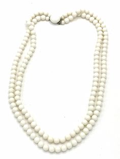 Vintage white beads necklace. White Long Necklace In Costume Jewelry Style, White Long Costume Jewelry Necklace, Vintage White Beaded Chain Necklace, Vintage White Necklace With Beaded Chain, White Single Strand Long Beaded Necklace, White Long Beaded Necklace, Vintage White Double Strand Pearl Necklace, White Beaded Long Shell Necklace, Vintage White Necklaces With Large Beads