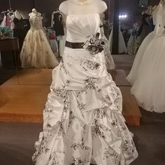 a wedding dress on display in a store