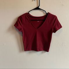 A Slightly Cropped V-Neck Fitted Tee By Wild Fable In A Beautiful Burgundy Color. Size Small. It Is Brand New Never Been Worn, I Ordered Online And Only Wore It To Try It One, Unfortunately The Tags Got Pulled Off While Trying It On So I Can’t Return It As It Was To Small. It’s A Great Tee That Is Super Flattering And Hits All The Right Spots On Your Body. I Know I Reorders A Size Up! Red Fitted V-neck Top, Basic V-neck Stretch Crop Top, Red Stretch V-neck T-shirt, Red Cotton V-neck Crop Top, Red V-neck Casual T-shirt, Red Cotton V-neck Top, Spring Red V-neck Crop Top, Red V-neck Crop Top For Spring, Red V-neck Cotton Crop Top