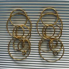 These hoop earrings are the perfect pair of earrings to dress up your outfit. Material: Gold plated Length: 7 cm Gold-tone Gold Plated Hoop Earrings, Gold-tone Gold-plated Hoop Earrings, Yellow Gold Metal Hoop Earrings For Parties, Modern Brass Hoop Earrings For Party, Gold Plated Small Hoop Earrings For Party, Gold-tone Hoop Earrings For Party, Small Hoop Gold Plated Earrings For Party, Chic Gold Circle Hoop Earrings, Party Gold-tone Drop Hoop Earrings