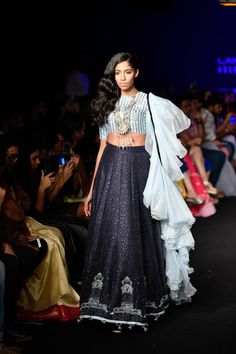 Lakme Fashion Week 2018 Bridal Picks. Navy blue lehenga with ruffles dupatta. #frugal2fab Sequin Outfit Ideas, Lehenga Designs Bridal, Drape Ideas, Sharara Design, Lehenga Ideas, Navy Blue Lehenga, Khatli Work, Sequin Lehenga, Wanderlust Fashion