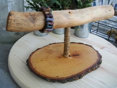 a small tree stump with a large wooden stick sticking out of it's center