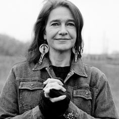 a black and white photo of a woman holding her hands together