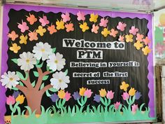 a bulletin board is decorated with flowers and the words,'welcome to pm believing in yourself is secret of the first success