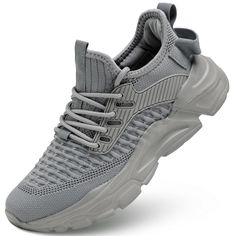 a gray sneaker with laces on the side