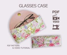 the glasses case is made from floral fabric and has a pink flower pattern on it