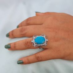 Natural 1.49 Ct. Oval Shape Turquoise Gemstone Pave Diamond Cocktail Ring Solid 14k White Gold Handmade Jewelry Anniversary Gift For Women                                                         ►Gemstone: Natural Turquoise  ►Base Metal: Sterling Silver (S925) ►Plating: Rhodium Plating ★Natural  Turquoise  stone cannot be always the same, gemstone colour may change in different light/background condition. ★Gemstone size: ★Center Stone - 10 mm x 12 mm ★Center Stone Weight- approx. 5 carat ★Band measurements: approx. 1.8mm wide, approx. 1.5mm thick ★Pictured in Gold Vermeil, available also in White Rhodium or rose gold vermeil. Also available in solid gold. ★ In Sterling Silver Option All Jewelry Will Be Rhodium Plated. ♥ Packaging: All jewelry comes in a beautiful and careful packaging 🛍 I Gift Turquoise Diamond Ring With Center Stone, Gift Turquoise Ring With Diamond Center Stone, Formal Turquoise Rings With Gemstone Accents, Turquoise Ring With Accent Stones For Promise, Oval Diamond Turquoise Ring For Formal Occasions, Turquoise Diamond Ring Gift, Formal Oval Turquoise Ring With Diamond, Formal Fine Jewelry Turquoise Ring With Accent Stones, Formal Turquoise Diamond Ring With Gemstone