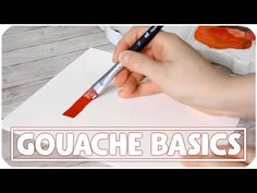 someone is holding a brush and drawing on paper with the words gouache basics