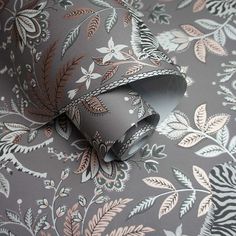 an image of a wallpaper pattern with leaves on grey background and white trimmings