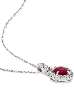 Give in to the glamour and elegance of this ruby heart and diamond halo pendant necklace. Formal Heart Pendant Jewelry With Diamond Accents, Fine Jewelry Heart Pendant Necklace With Prong Setting, Formal Heart-shaped Jewelry With Prong Setting, Heart Pendant Jewelry With Diamond Accents For Formal Occasions, Elegant Heart Cut Ruby Necklaces, Round Cut Jewelry For Valentine's Day Formal Occasions, Round Cut Jewelry For Valentine's Day Formal, Red Diamond Heart Pendant Jewelry, Formal Ruby Heart Cut Necklace