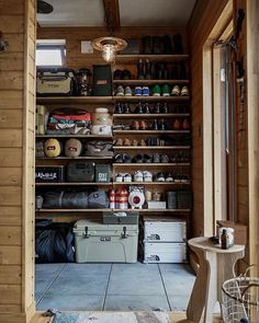 a room filled with lots of wooden shelves and shoes on top of eachother