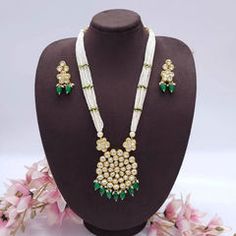 Gold Rodium Polish Green color Necklace in Metal Alloy studded with Beads White Beaded Chain Jewelry For Festive Occasions, Festive Pearl Beaded Chain Jewelry, White Jeweled Necklaces For Festivals, White Jeweled Necklace For Festivals, Festive White Beaded Chain Jewelry, White Jeweled Necklaces For Celebration, White Kundan Jeweled Necklace, Festive Beaded Pendant Jewelry, Kundan Beaded Long Necklace