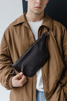 This hip bag, crafted with high-quality leather, is more than just a brown fanny pack; it's a versatile and trendy crossbody pouch that combines fashion and convenience seamlessly. This leather waist bag offers a hands-free solution for carrying essentials, providing the utmost convenience for various activities. The rich brown hue and sleek design make it a stylish accessory for any occasion, making it an excellent choice for anniversary gifts that blend practicality with fashion. Surprise your Brown Leather Belt Bag With Cell Phone Pocket, Brown Chest Bag With Pockets For Everyday Carry, Brown Shoulder Belt Bag For Everyday Carry, Brown Belt Bag With Cell Phone Pocket For Everyday, Brown Pouch Belt Bag With Cell Phone Pocket, Brown Leather Belt Bag With Coin Pocket, Brown Crossbody Belt Bag With Cell Phone Pocket, Brown Belt Bag With Coin Pocket, Brown Belt Bag With Zipper Pocket For Everyday