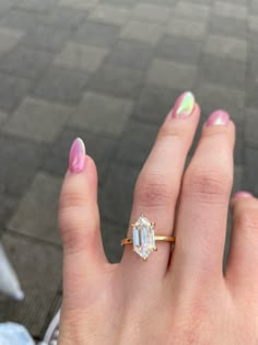 a woman's hand with a ring on it