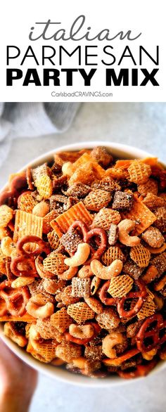 a bowl full of party mix with the words italian parmesan party mix above it