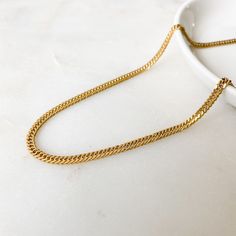 Gold curb chain necklace in gold plated stainless steel ❀❀ INFO: ❀❀ ➳ Gold plated over 304 stainless steel ➳ Tarnish resistant / non tarnish ➳ Chain size: 3 x 2 mm ➳ Lobster clasp closure ➳ Optional extender chain available Rose pendant necklace shown layered in 4th photo: https://www.etsy.com/listing/860235726/rectangular-rose-medallion-pendant?ref=shop_home_active_1 ❀❀ SHIPPING & PROCESSING: ❀❀ Please refer to my shop announcements (located on home page) for the latest processing times as Minimalist Cuban Link Curb Chain Necklace, Minimalist Cuban Link Chain Necklace With Curb Chain, Gold Cuban Link Necklace Minimalist Style, Gold Minimalist Cuban Link Necklace As Gift, Gold Cuban Link Necklace With Cable Chain As Gift, Minimalist Gold Plated Cuban Link Chain Necklace, Gold Stainless Steel Delicate Chain Necklace, Minimalist Gold Stainless Steel Chain Necklace, Gold Cuban Link Necklace With Cable Chain