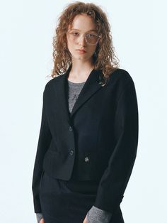 Editor's NotesThe tailored short jacket is made with TR twill fabric. The jacket has voluminous sleeves with meal logo symbol as an accent. - 2 button notched collar design- For semi-formal or formal occasion- Simple and stylish lookMeasurements(in.)ONE SIZE (XS-M)- Length: 20.28 in.- Shoulder: 19.69 in.- Chest: 20.08 in.- Bottom Hem: 17.91 in.- Sleeve Length: 22.24 in.- Sleeve Width: 7.48 in.- Sleeve Hem: 5.31 in.*Model size: Height 5'91, Bust 32, Waist 25, Hip 35*Model size: Height 5'68, Bust 32, Waist 24, Hip 34*Model size: Height 5'71, Bust 32, Waist 23, Hip 35*Model size: Height 5'61, Bust 30, Waist 24, Hip 35*Size is based on cross-section, and errors may occur depending on the measurement method and location.Composition & Care- Shell: 80% Tencel, 16% Rayon, 4% Spandex &nbsp Black Wool Blazer For Office Wear, Black Wool Blazer For Office, Classic Wool Cropped Jacket Single Breasted, Classic Cropped Jacket For Winter Formal Events, Classic Winter Cropped Jacket For Formal Occasions, Classic Business Cropped Jacket With Button Closure, Classic Cropped Jacket With Button Closure For Business, Formal Notch Lapel Cropped Jacket For Fall, Elegant Wool Cropped Jacket For Work