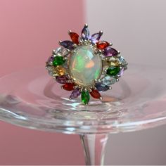 Premium Ethiopian Welo Opal, Multi Gemstone (Red Fire Opal, Chrome Diopside, Brazilian Citrine, African Amethyst And Skyblue Topaz) Floral Ring. Total Carat Weight Is 3.40. The Opal Is 9x7. Set In Platinum Over .925 Sterling Silver. Size 8. Nwt Multicolor Oval Gemstones For Anniversary, Oval Multicolor Gemstones For Anniversary, Oval Multi-stone Jewelry For Party, Elegant Multicolor Opal Ring, Multicolor Multi-stone Opal Ring, Multicolor Oval Jewelry With Accent Stones, Formal Multicolor Opal Gemstone Ring, Multicolor Round Gemstones With Stone Setting, Fine Jewelry Multicolor Multi-stone Opal Ring