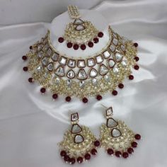 Gold Rodium Polish Red and Maroon color Necklace in Metal Alloy studded with CZ Diamond, Kundan, Pearl Maroon Necklace, Nath Nose Ring, Violet Necklace, Heavy Earrings, Bridal Fashion Jewelry, Color Necklace, Metal Necklace, Kundan Necklaces, White Necklace