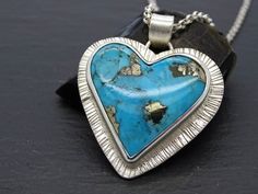 big heart pendant silver, real Turquoise pyrite pendant, Turquoise heart charm pendant Ithaca peak Turquoise necklace, unique gift for women// Big sterling silver heart pendant with a stunning Arizona turquoise gemstone.// Great gift for all mineral & gemstone collectors, lovers of natures creations and the Great Outdoors. // Rare Ithaka Peak Turquoise gemstone with beautiful pyrite inclusions.// Turquoise is a December birthstone. Also a great gift for your 6th and 11th anniversary.> stunning n Handmade Turquoise Jewelry For Valentine's Day, Silver Turquoise Heart Pendant Necklace, Silver Turquoise Heart Pendant Necklace Gift, Sterling Silver Turquoise Heart Pendant Necklace As Gift, Turquoise Heart Charm Necklace As Gift, Heart-shaped Sterling Silver Turquoise Necklace, Sterling Silver Turquoise Necklace With Heart Charm As Gift, Turquoise Heart Pendant Necklace Gift, Turquoise Necklace With Heart Charm As Gift