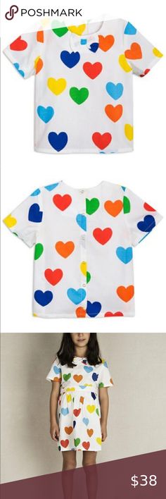 🆕 Mini Rodini Rainbow Love Woven Top Off white blouse in 100% organic woven cotton with all over rainbow love. The blouse has short sleeves, rounded collar, bow at neckline and snaps down the back. Coordinating skirt available. EUR sizing Mini Rodini Shirts & Tops Tees - Short Sleeve White Casual Blouse With Heart Print, Summer White Blouse With Heart Print, White Heart Print Blouse For Summer, Summer Cotton Top With Heart Print, Multicolor Heart Print Crew Neck Top, Cute Multicolor Cotton Blouse, Cute Multicolor Short Sleeve Blouse, White Short Sleeve Tops With Heart Print, Playful Heart Print Summer Tops