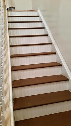 there is no image here to provide a caption for in this case, the stairs are brown and white