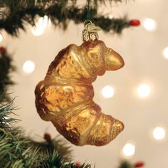 a glass ornament hanging from a christmas tree