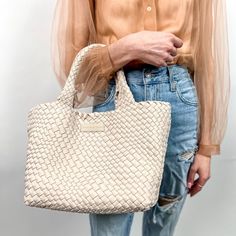 Our most popular woven totes are handwoven with a lycra blend and contrasting weave. Each tote comes with a matching pouch and detachable strap to transform your tote into a crossbody! Color: Bone Dimensions: Expanded: 18” x 9” x 8” / 6” Handle Drop Woven Double Handle Bags For On-the-go, Natural Straw Tote Bag For On-the-go, Natural Straw Bag With Braided Handles For On-the-go, Versatile Bucket Bag Tote With Braided Handles, Spring Woven Leather Top Handle Bag, Spring Top Handle Bag In Woven Leather, Modern Woven Bags For On-the-go, Beige Woven Bags For On-the-go, Trendy Handwoven Top Handle Bag