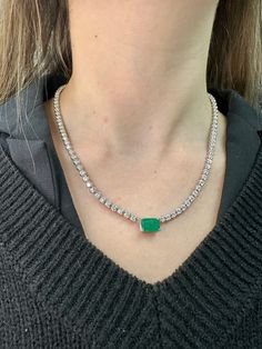 This very requested and popular tennis necklace is an absolute beauty. Elevate the look of a classic Tennis Necklace with a beautiful Emerald center Stone for a more unique piece. You will definitely not want to take off this gorgeous piece, it can be dressed up or down depending on how you wear .  Material: Solid 14K White Gold Diamonds: Round Cut, Prong Setting  *These are 100% Natural Earth Mined Diamonds. Carat: Approximately 2.50Ct Emerald Center Stone- 8.50Ct Round Diamond Side stones  Col Formal White Gold Tennis Necklace With Gemstone, Luxury Formal Emerald Necklace With Vvs Clarity, Luxury Single Strand Tennis Necklace, Luxury Vvs Clarity Emerald Necklace For Formal Occasions, Classic Diamond Tennis Necklace With Gemstones, Classic Emerald Necklace With Brilliant Cut Cubic Zirconia, Fine Jewelry Tennis Necklace With 17 Jewels For Anniversary, Elegant Round Gemstone Tennis Necklace, Luxury Gemstone Tennis Necklace