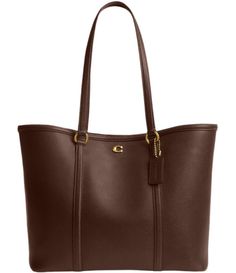 From COACH, the Legacy Pebbled Leather Tote Bag features: A classic wardrobe staple, this polished pebbled leather tote by COACH is always in style. LeatherSnap closureBrass-tone hardware & logo; interior zip pocketSpot cleanApprox. 11"W x 11"H x 5-.5"D (width is measured across the bottom of handbag); 1.65 lbs. approx. weightApprox. 10" L handlesImported. College Tote Bag, Leather Computer Bag, Classic Leather Tote, Leather Work Bag, Big Handbags, Coach Leather Bag, Vintage Tote Bag, Coach Legacy, Mom Bags