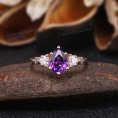 Amethyst Engagement Ring Unique Triangle Cut Moissanite Cluster Wedding Ring Art Deco Pear Shaped Purple Gemstone Rose Gold Bridal Ring RING DESCRIPTION ✦Engagement Ring ✴Center Stone - Amethyst Shape - Pear Cut Size - 6x8mm ✴Side Stones - Moissanite & Alexnadrite Shape - Triangle & Round Cut Weight - 0.26ct ✴Band Width - About 1.5mm ✴Ring Metal: Available in rose gold plated, yellow gold plated, 925 sterling silver, 10k or 14k solid rose, yellow or white gold. MAKING & SHIPPING ✦PAYMENT PLAN ♡ Amethyst Engagement Rings, Purple Engagement Rings, Cluster Wedding Ring, Wedding Ring Art, Wedding Rings Art, Moon Wedding, Amethyst Ring Engagement, Art Deco Wedding Rings, Purple Diamond