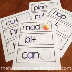 four printable cut and paste worksheets on a table